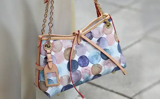   The side view of the leather-tanned, patchwork bag