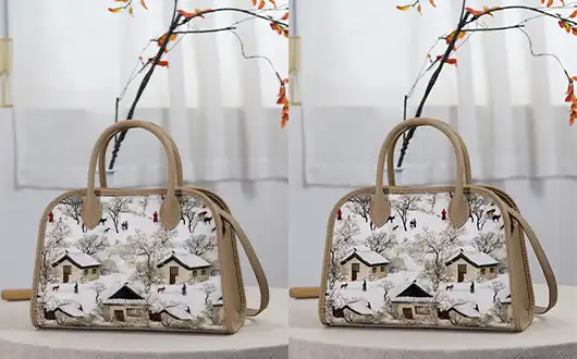 A hand-held tote bag made from canvas and leather.